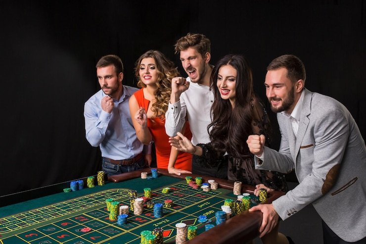 Live Caribbean Stud Poker table with dealer and player hands displayed